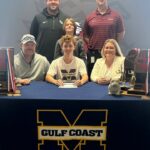 Bradyn Bowman signs tennis scholarship with Mississippi Gulf Coast Community College Bradyn Bowman (center) is surrounded by family and coaches as he signs a scholarship to play tennis