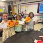 Second-grade class practices counting coins with pizza craft activity Photos from Ingomar Attendance Center's post